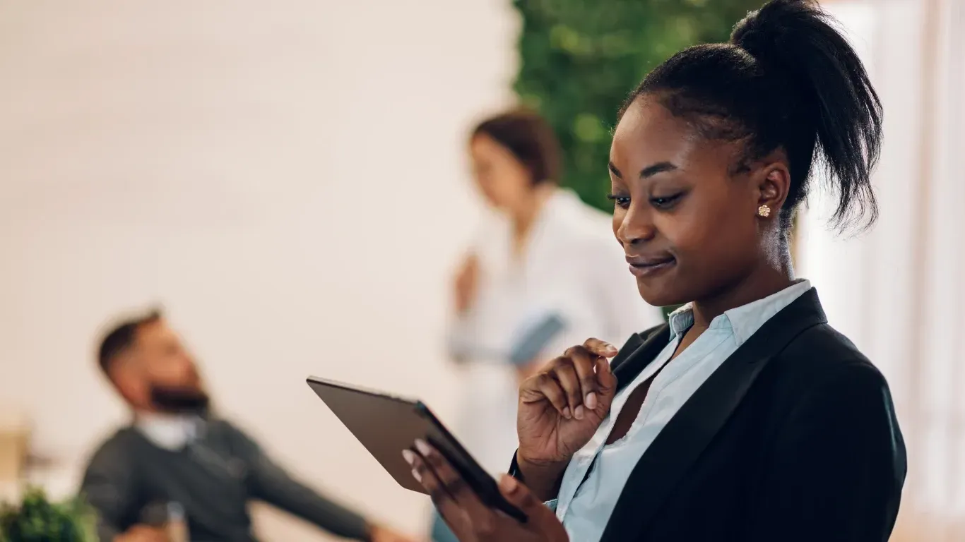 Small business owner reviewing financial reports and accounting services with KPI Solutions in Chelmsford Massachusetts