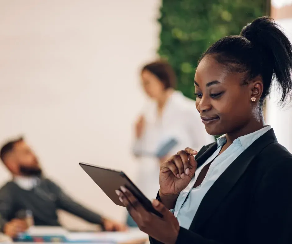 Small business owner reviewing financial reports and accounting services with KPI Solutions in Chelmsford Massachusetts