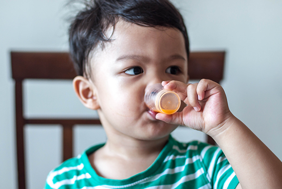Toddler Drinking Liquid Medicine — Princeton, WV — Hickman’s Pharmacy