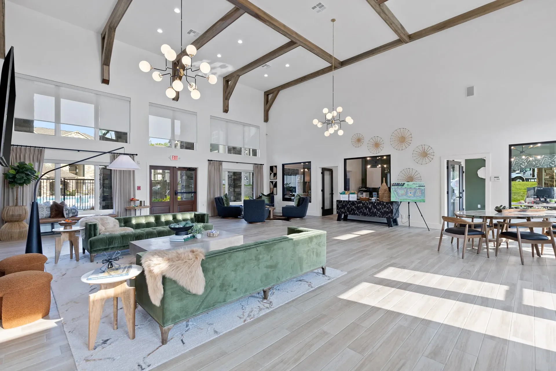 Bright and modern community lounge area with seating and decor.