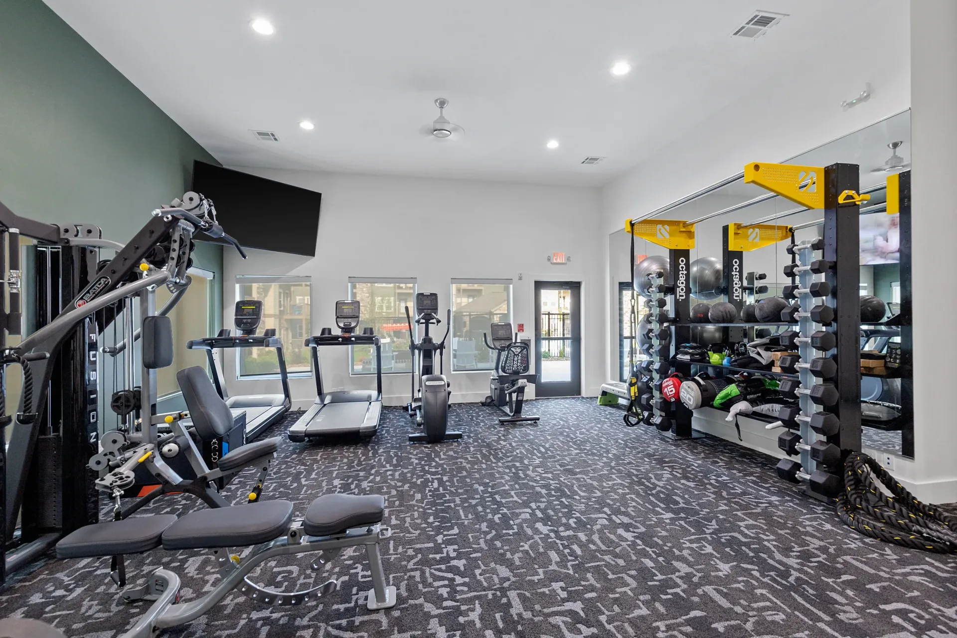 Interior view of a modern fitness center with exercise equipment