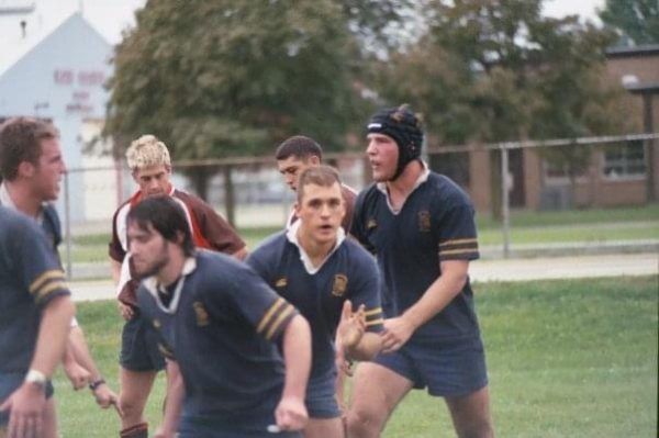 A group of young men are playing a game of rugby