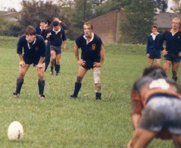 A group of men are playing soccer on a field