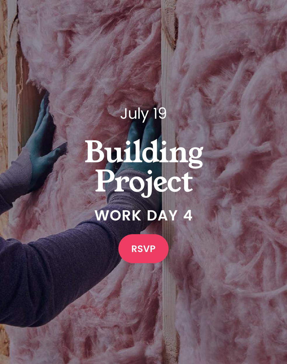 A person is insulating a wall with pink insulation.