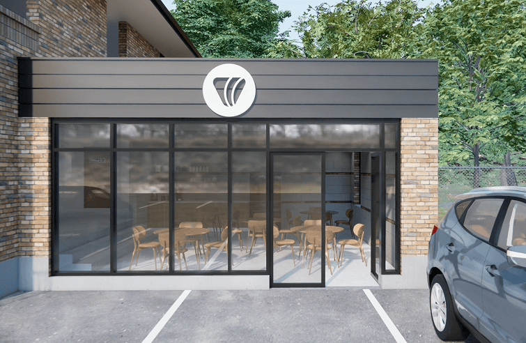 A car is parked in front of a restaurant with tables and chairs.