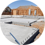 A house is being built on a concrete foundation.