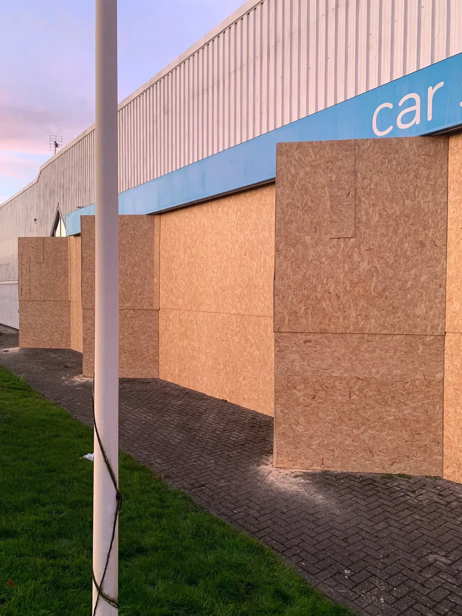 Wooden panels lined up along a building with 