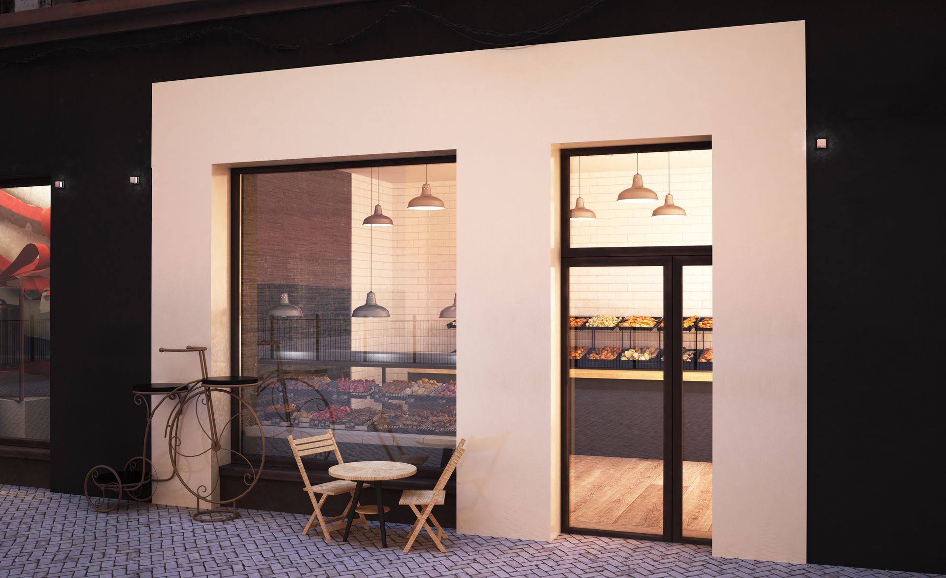 Exterior of a bakery with cream-colored facade, glass storefront, and outdoor seating.