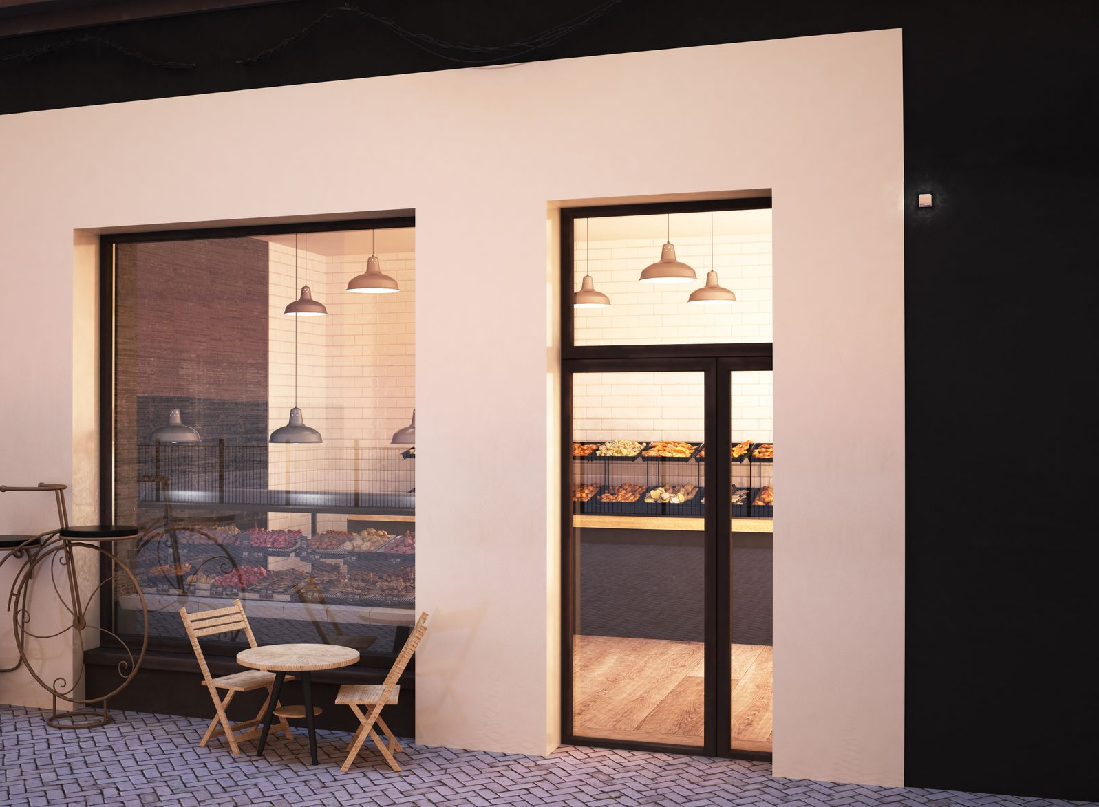 Exterior of a bakery with windows and a door, displaying interior lights, tables, and pastries.