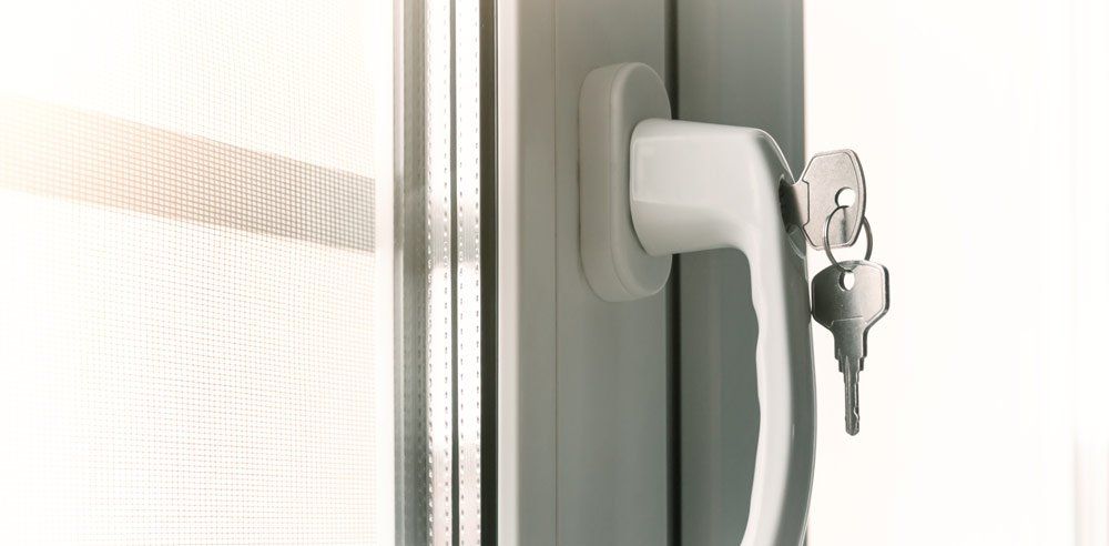 White window handle with keys.