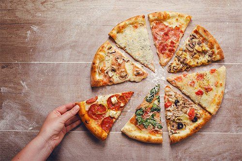 Sliced Pizza With Different Toppings