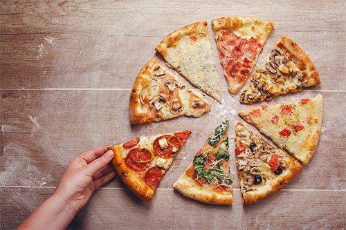 4 Reasons You and Your Friends Should Enjoy a Slice of Pizza — Top in Town  Pizza