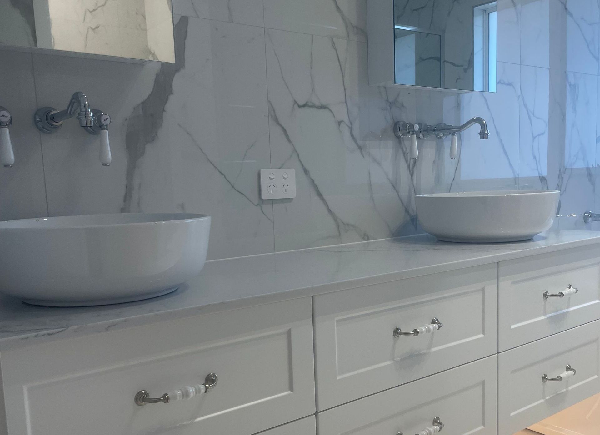 A White Box on the Side of a House That Says ' Heater ' on It — Smooth Flow Plumbing Cairns in Cairns City, QLD 