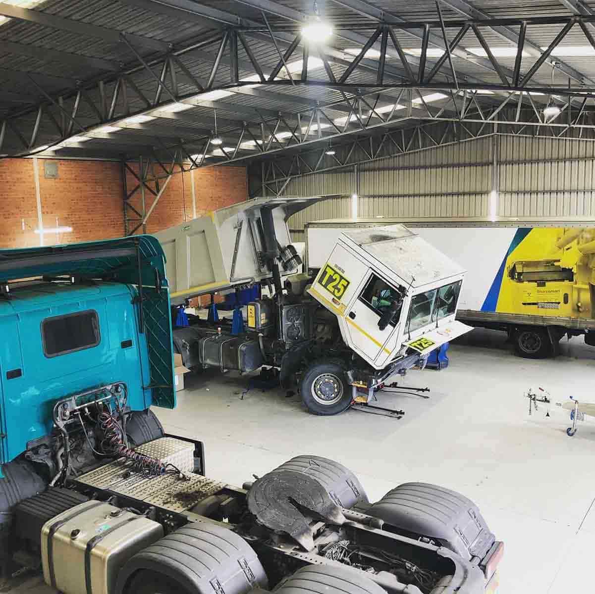 A Truck Is Sitting In A Warehouse With Its Roof Missing — Truckserv In Yallah, NSW