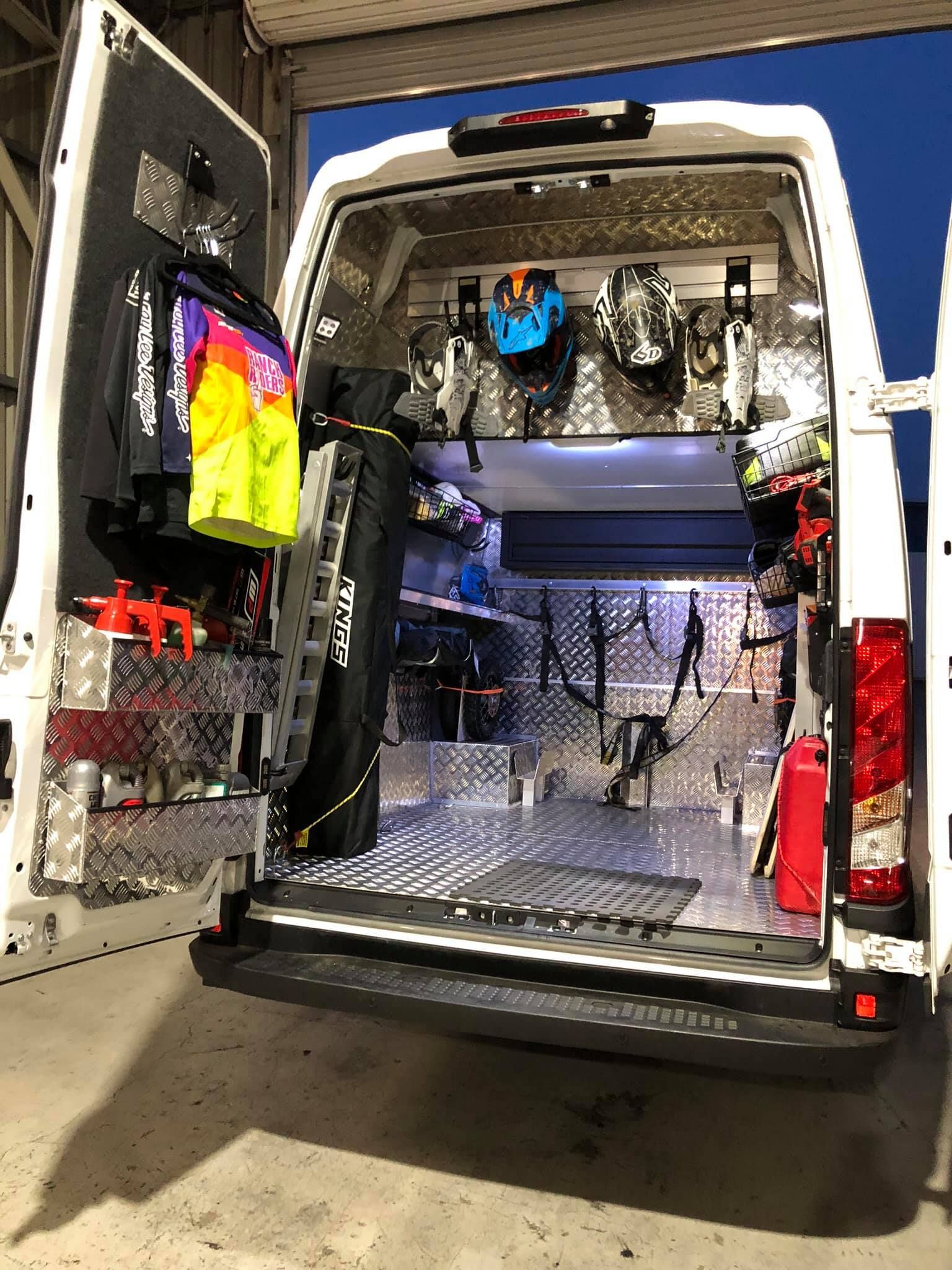 A White Van is Parked in a Garage With the Back Door Open — Truckserv In Albion Park, NSW