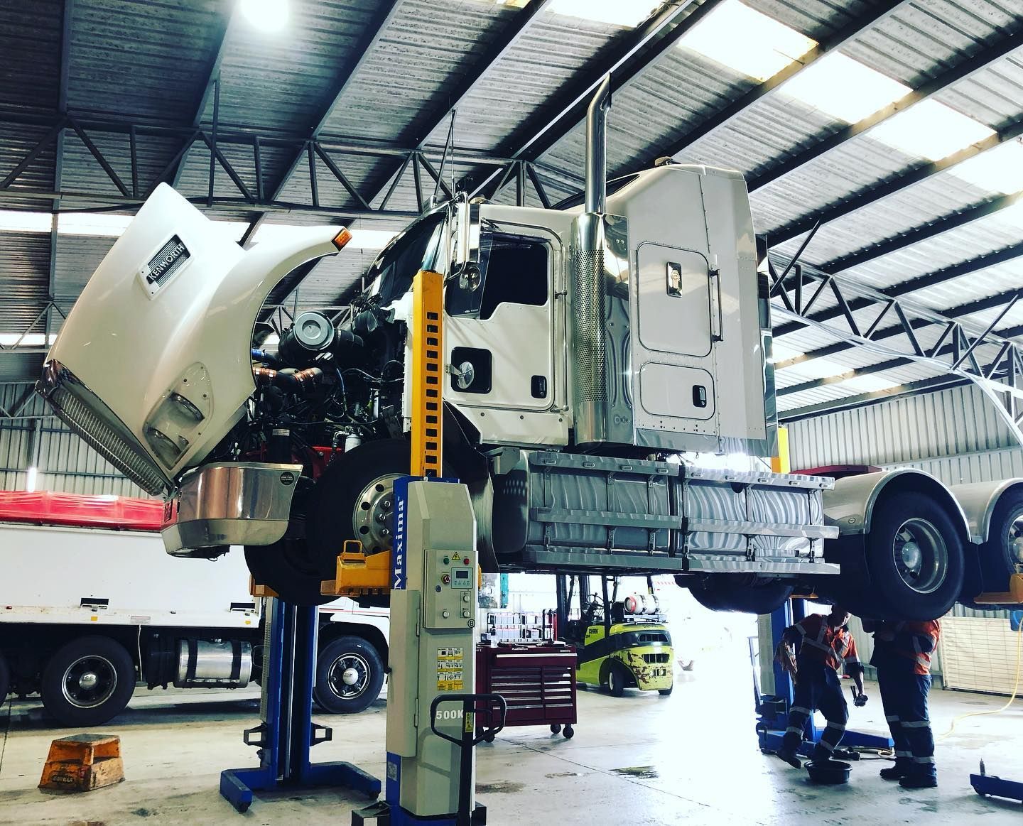 A Semi Truck is Being Repaired in a Garage — Truckserv In Yallah, NSW