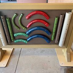 A board with a bunch of different colored pipes on it.