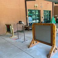 A group of wooden boards sitting on top of a concrete floor.