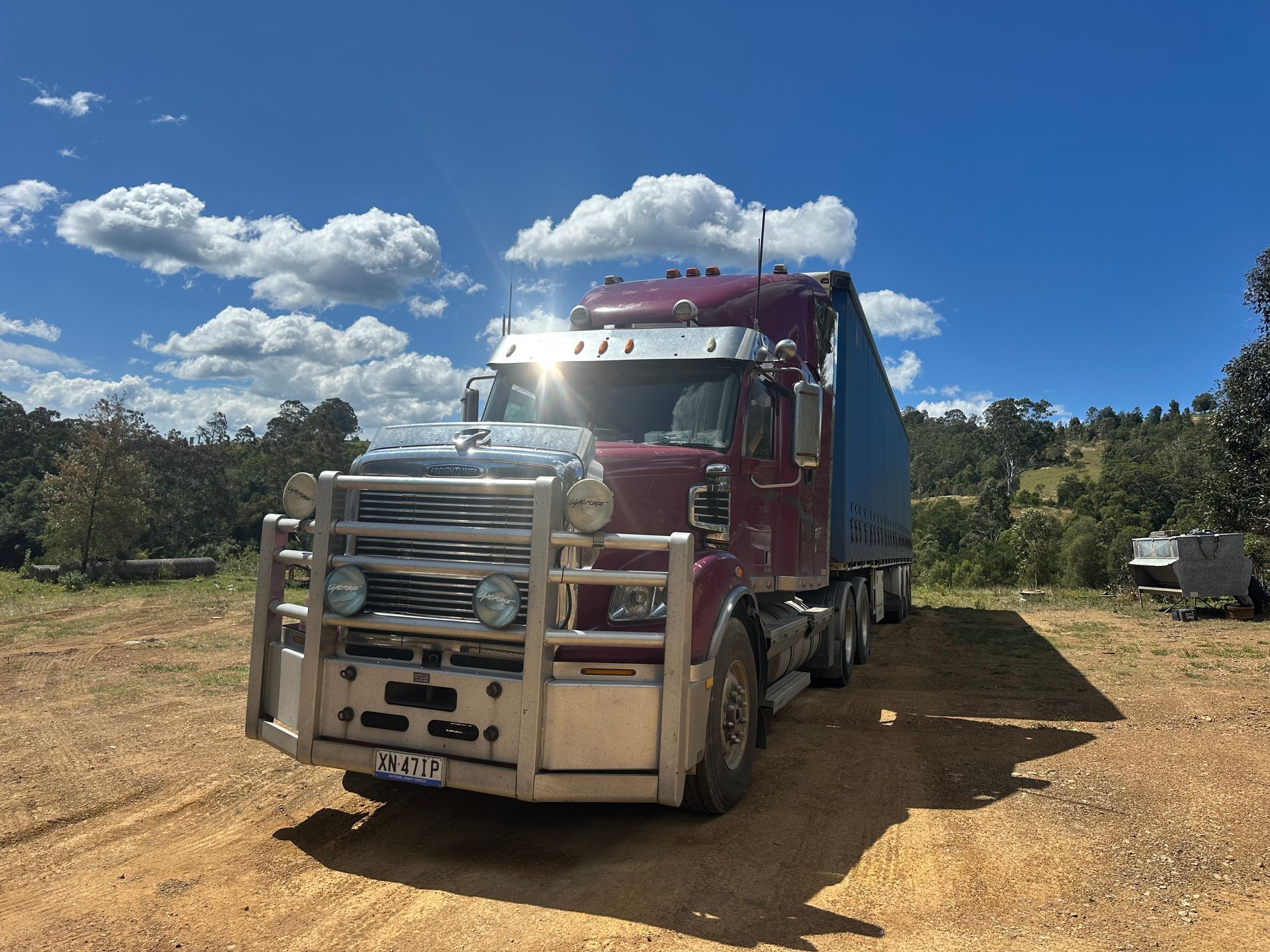 Front view of semi-truck parked on a dirt road — D & M Freighters Water In Bucca Wauka, NSW