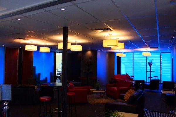 A large room with blue lights on the ceiling