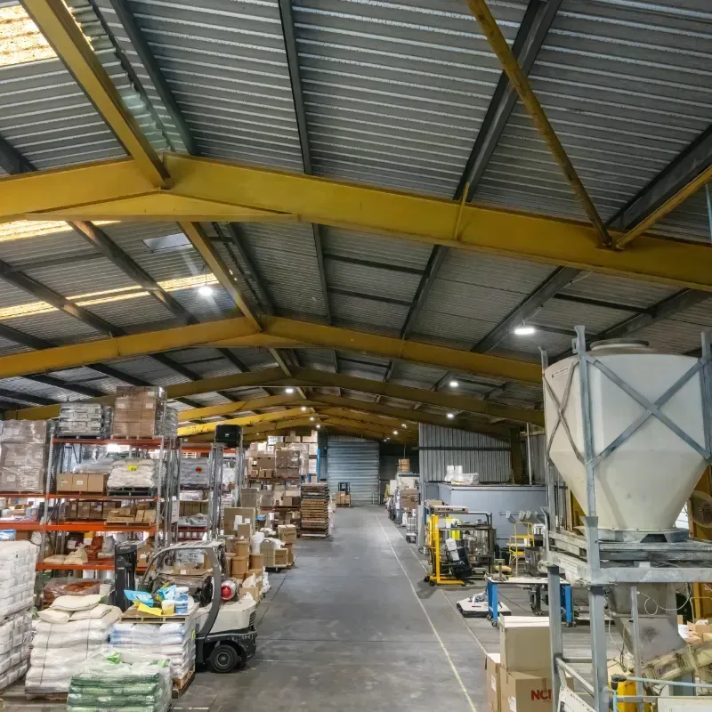A large warehouse filled with lots of bags and boxes