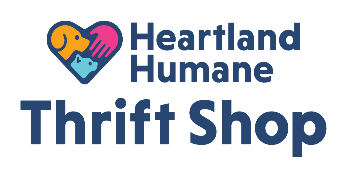 The logo for the heartland humane thrift shop.