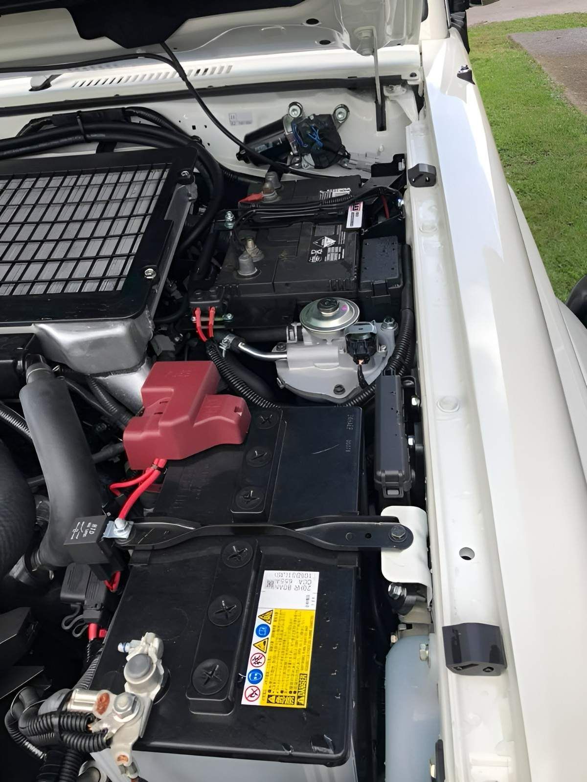 White Car Engine Bay with Black and Silver Components — S&P Complete Automotive in Port Macquarie, NSW