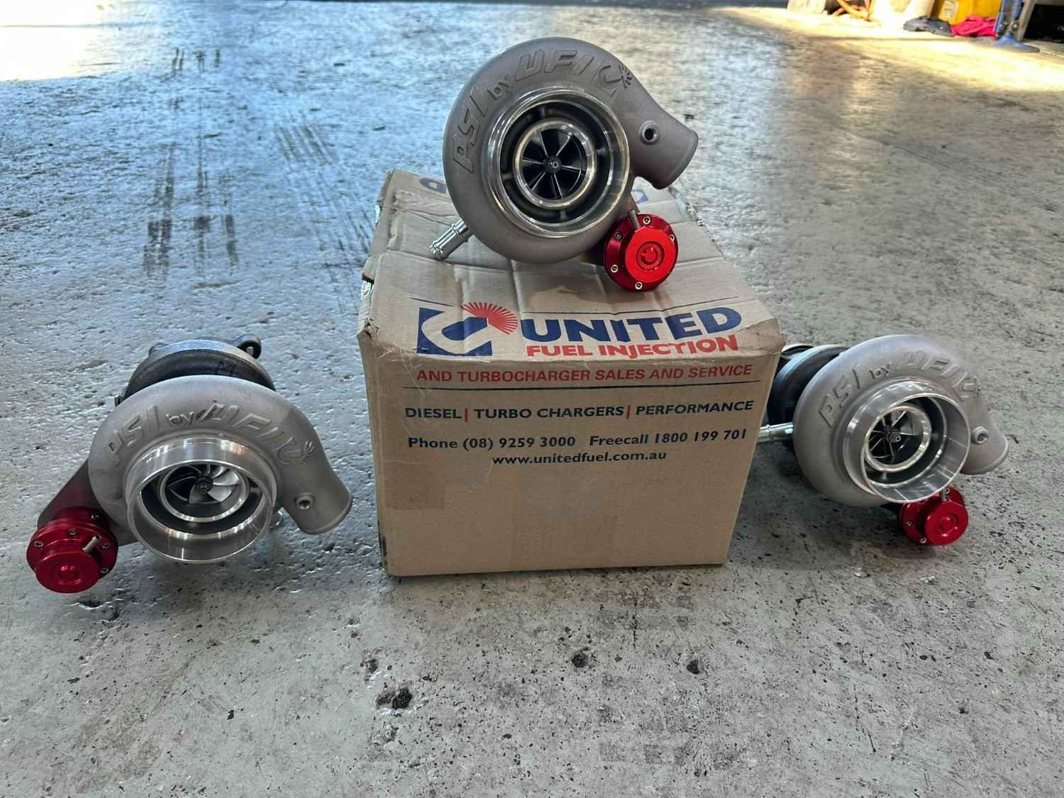 Three Turbochargers with Red Caps Arranged — S&P Complete Automotive in Port Macquarie, NSW