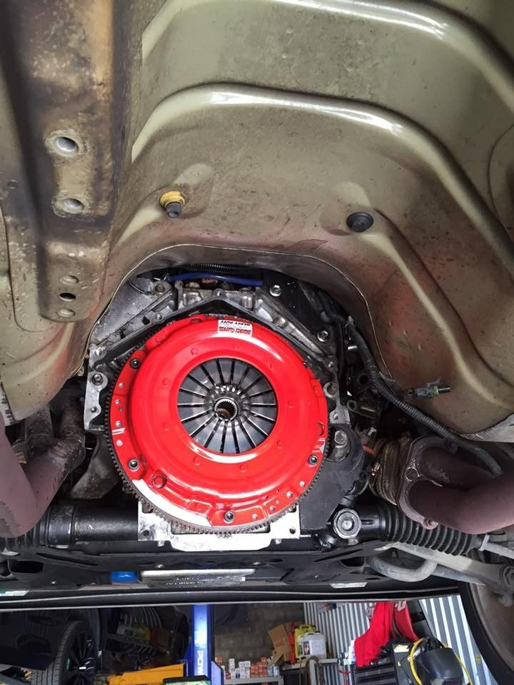 Red Clutch Assembly Installed in The Underside of A Car — S&P Complete Automotive in Port Macquarie, NSW