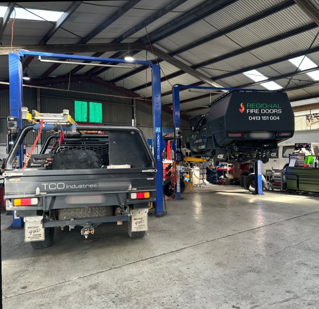 Truck in garage, one on a hoist — S&P Complete Automotive in Port Macquarie, NSW