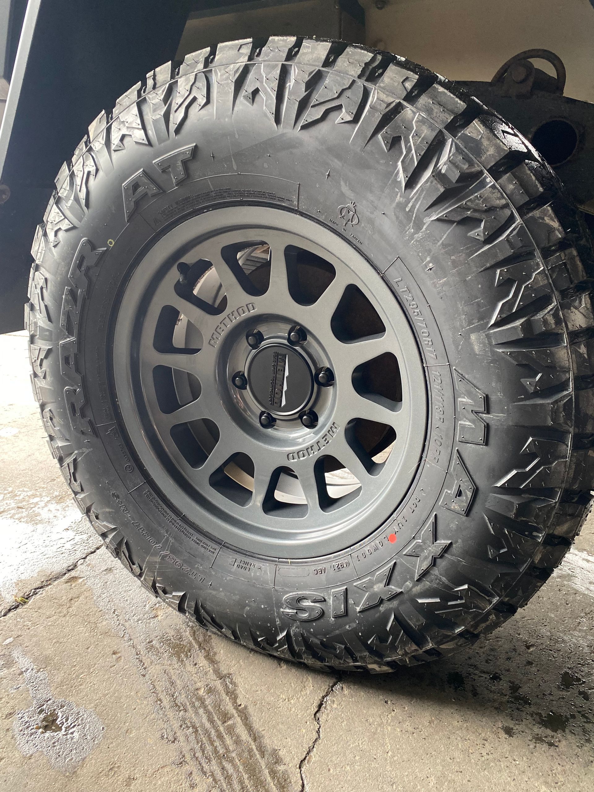 Black Off-Road Tire and Rim on A Vehicle with A Blue Suspension — S&P Complete Automotive in Port Macquarie, NSW