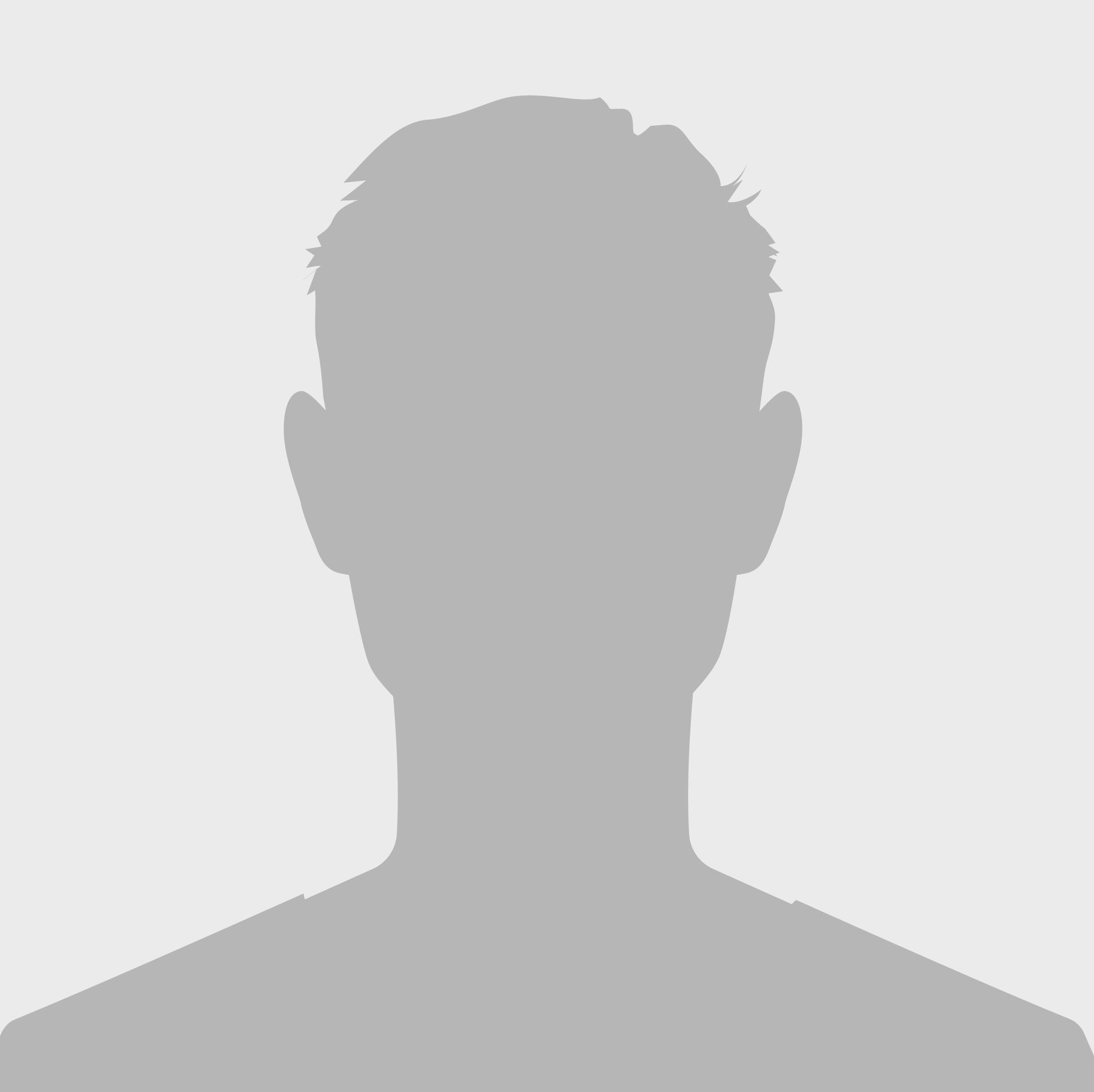 A man with a beard and glasses is wearing a blue sweater.