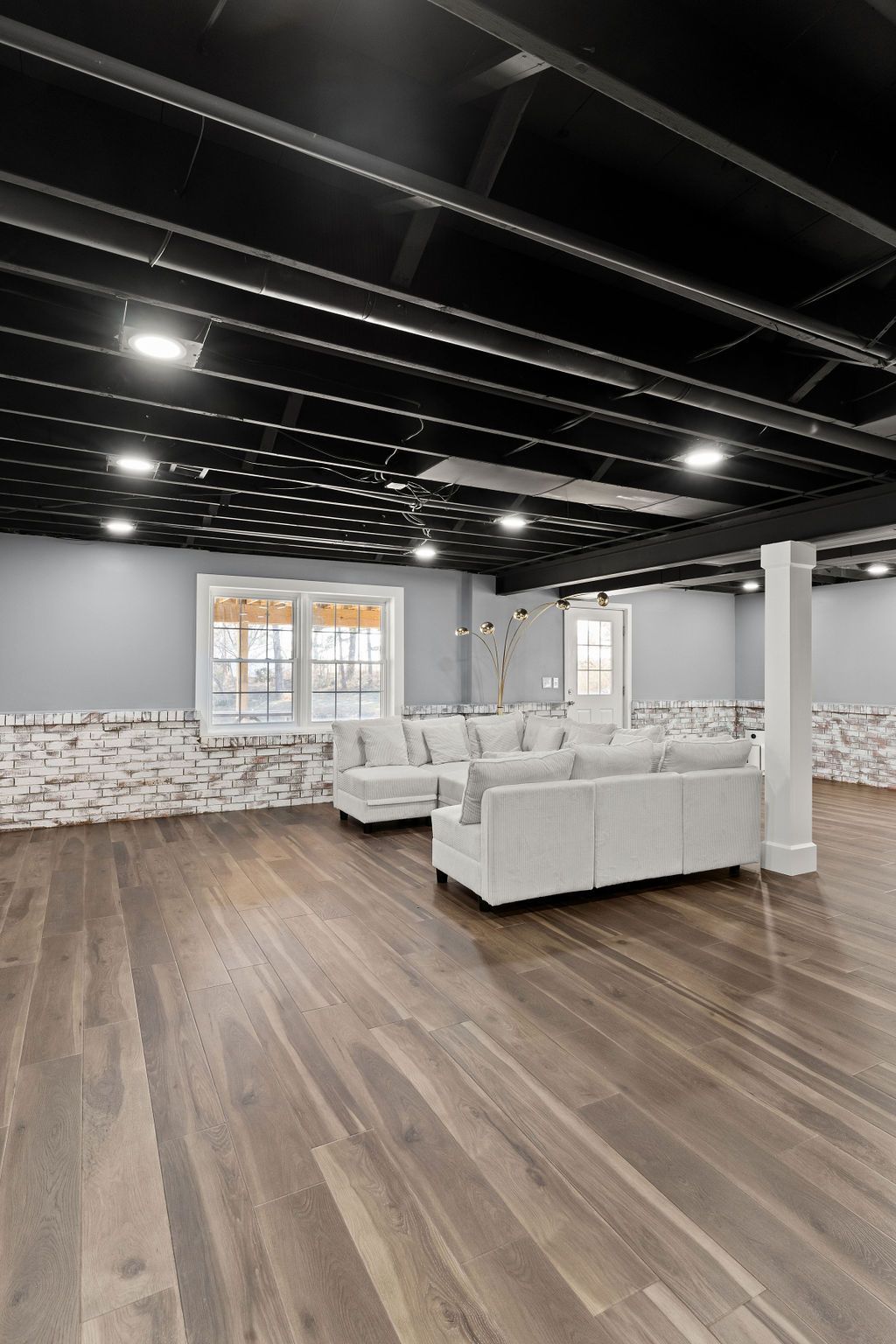Beautiful sunroom/porch with hard wood floors.