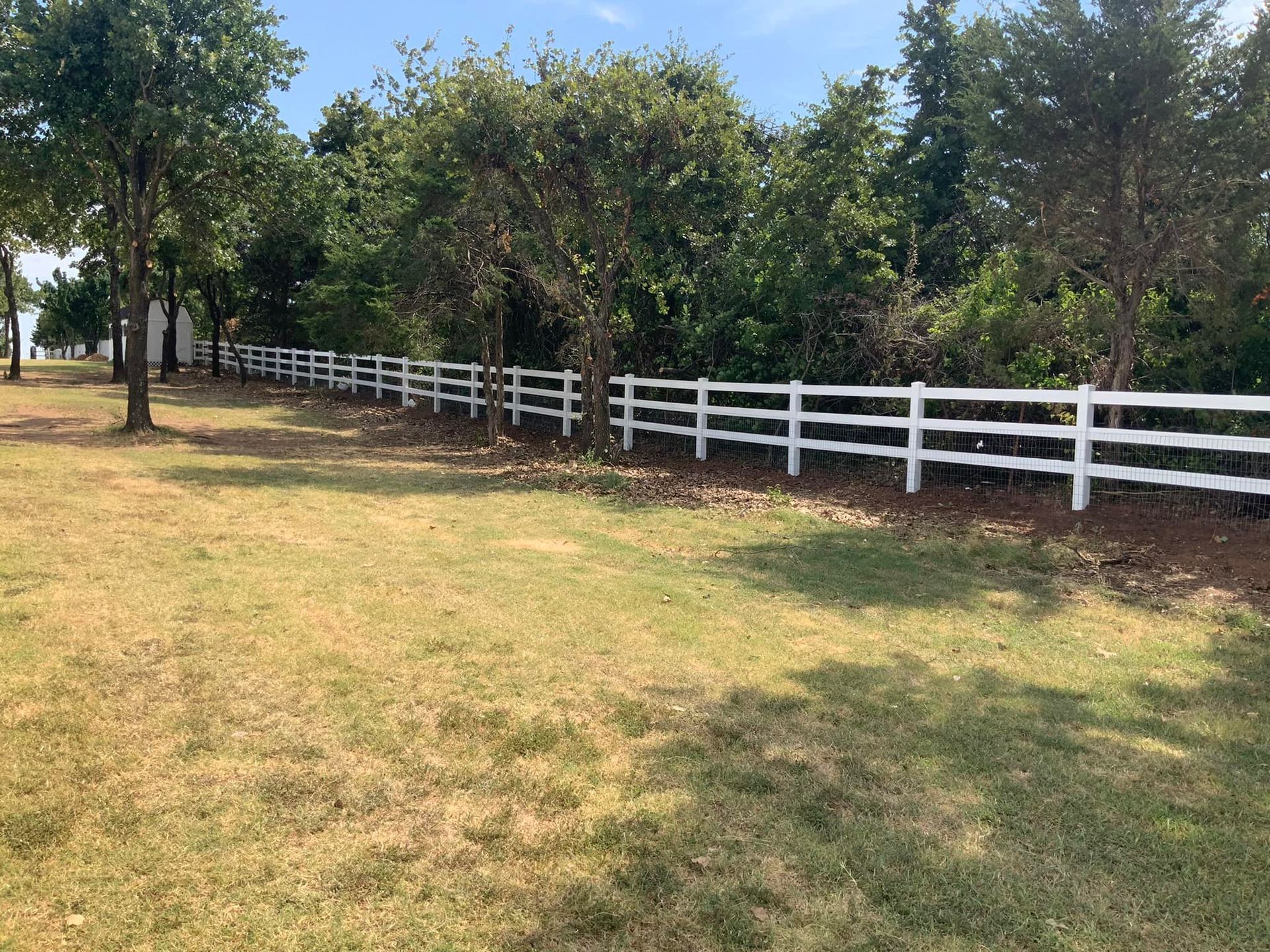 Heavy-gauge steel fence post installation — storm-resistant construction by Legacy Fence, Yukon OK