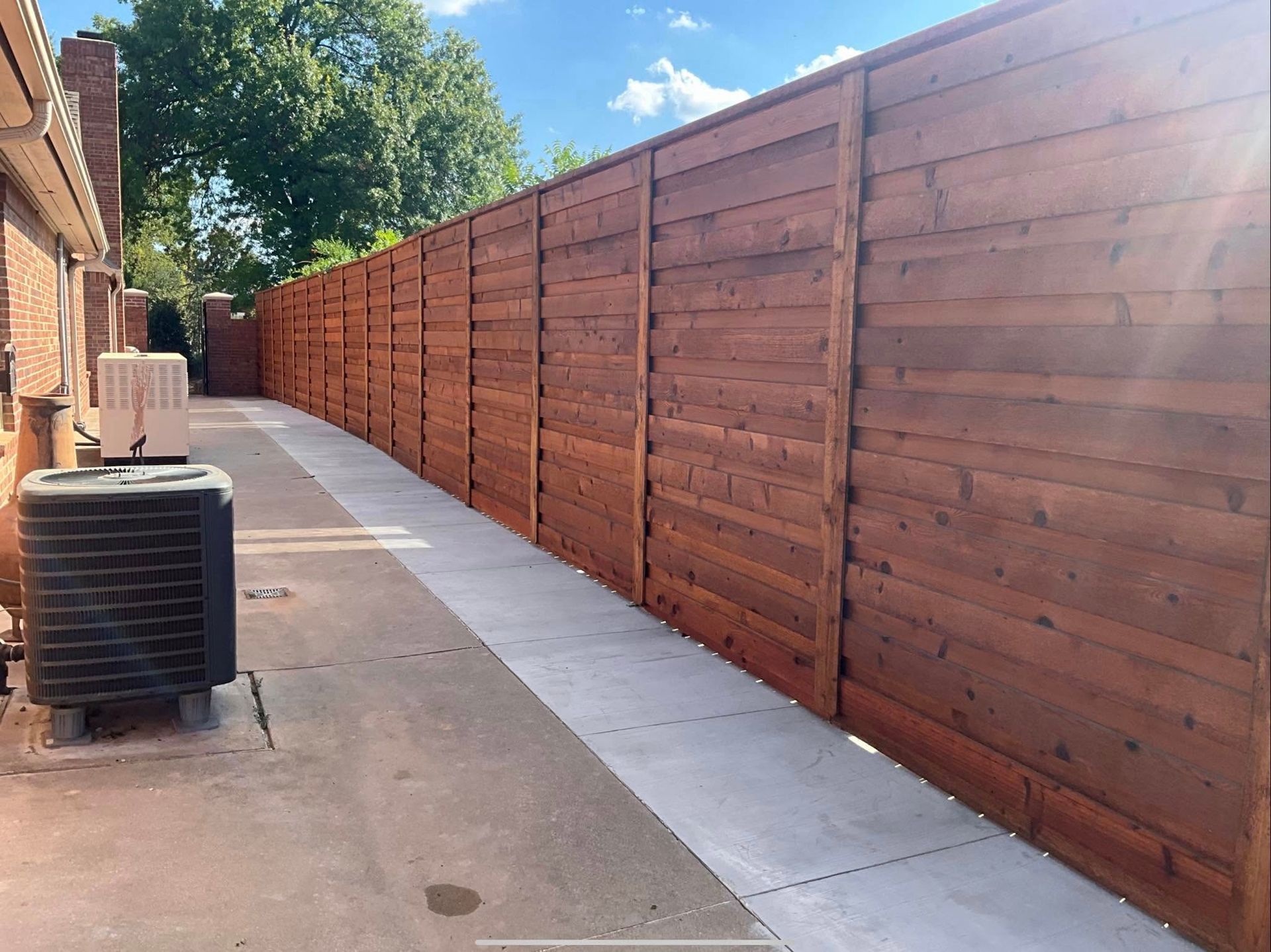 Cedar privacy fence installation at a Yukon, OK family home — Legacy Fence