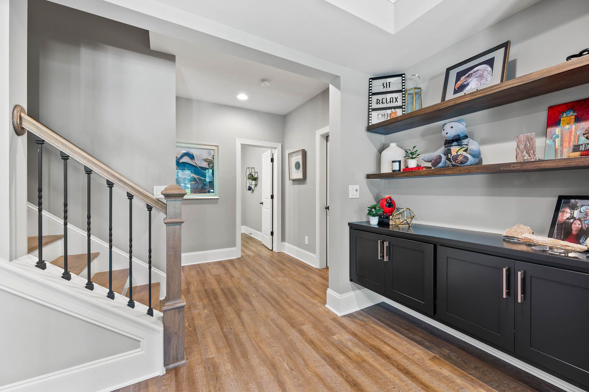 a hallway with a sign on the wall that says hi relax