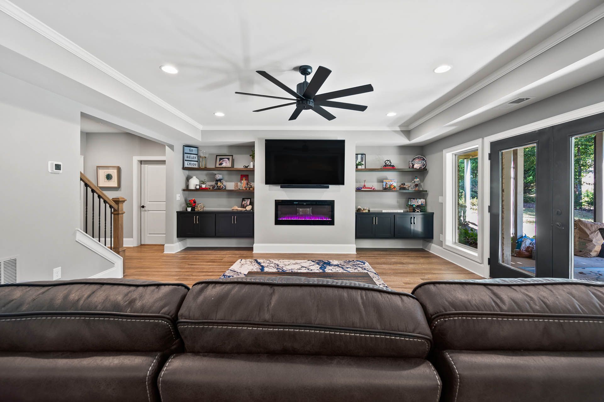a living room with a fireplace and a flat screen tv