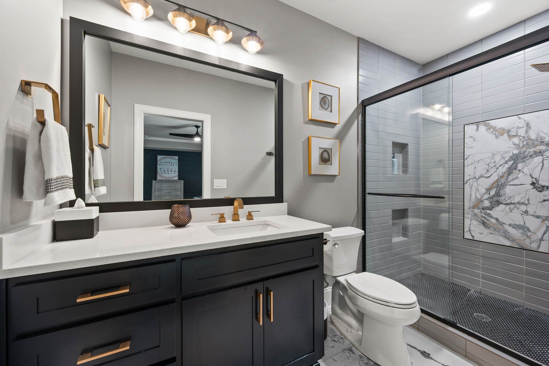 a bathroom with a toilet a sink and a mirror