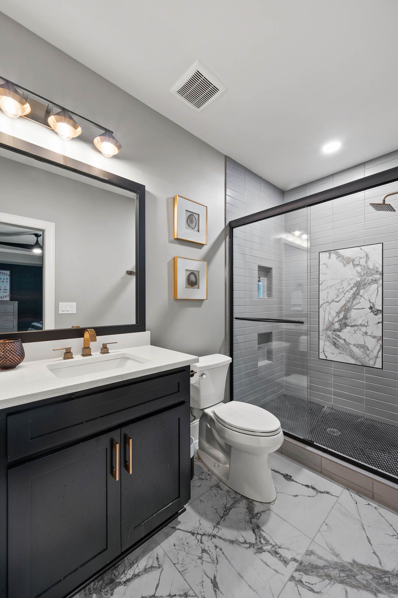 a bathroom with a toilet a sink and a shower