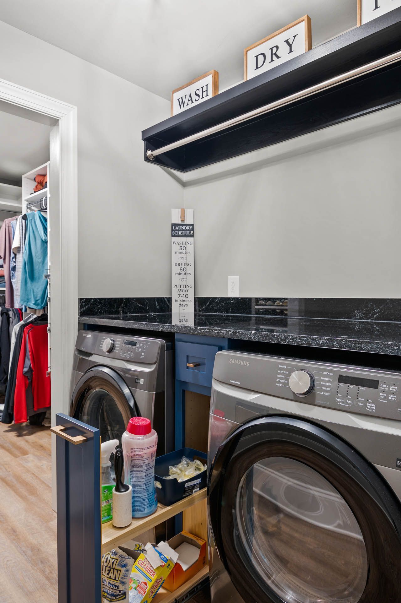 a laundry room with a samsung washer and dryer
