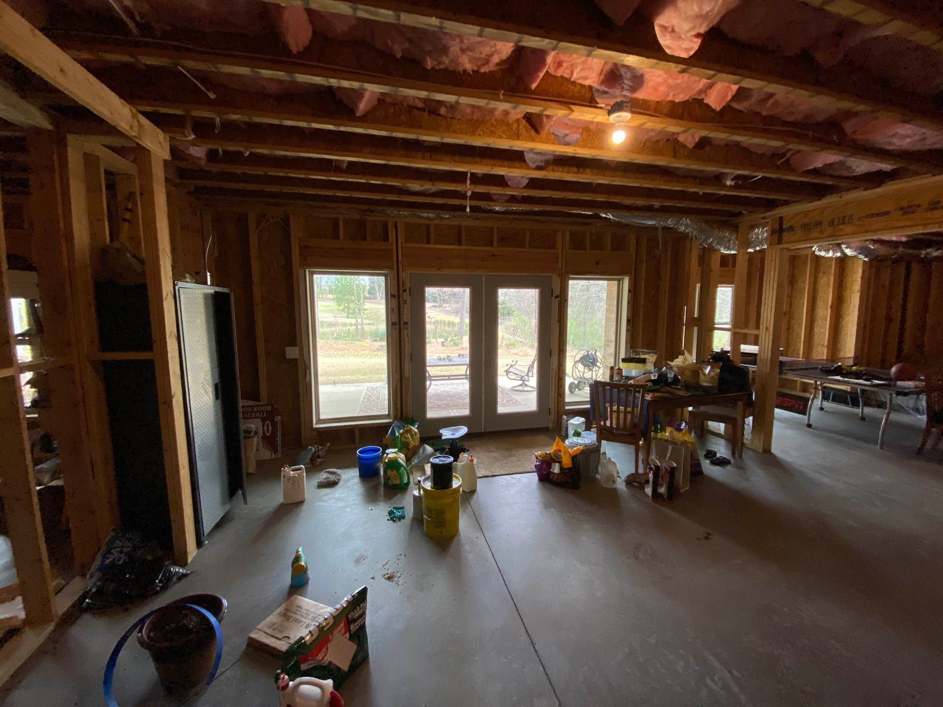 a room with a lot of cleaning supplies on the floor