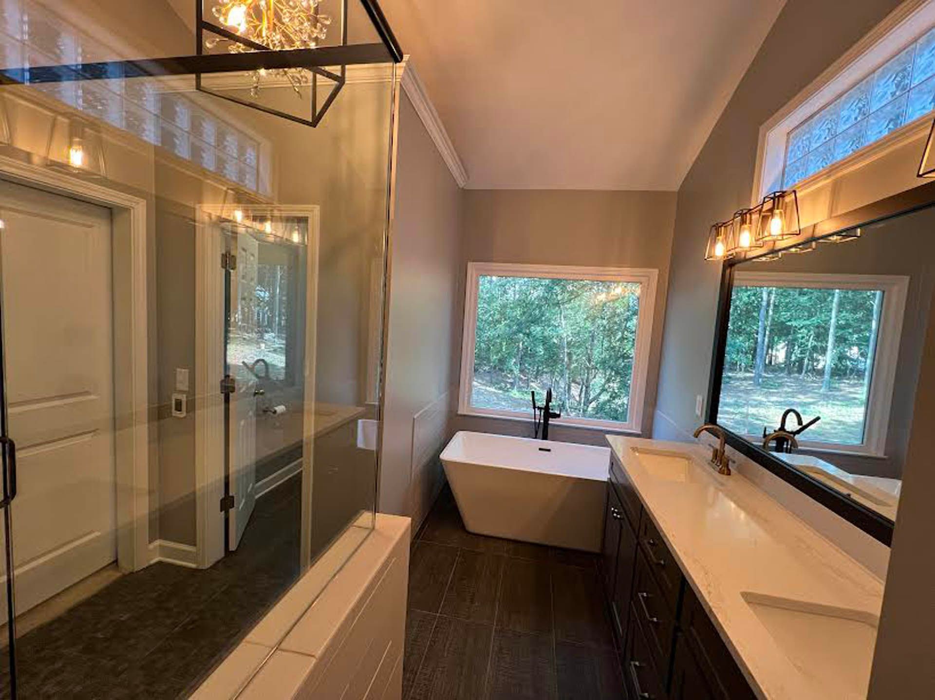 a bathroom with a bathtub and a large mirror