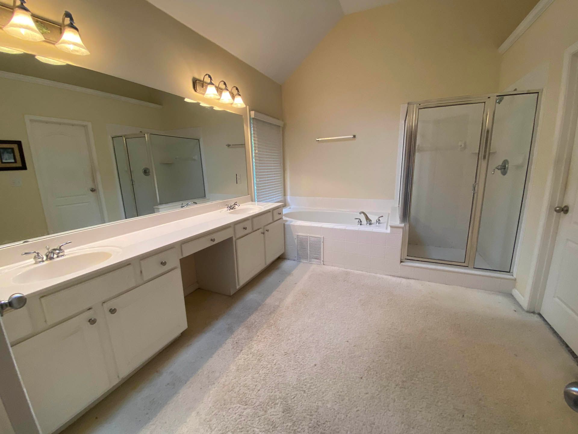 a bathroom with two sinks and a bathtub
