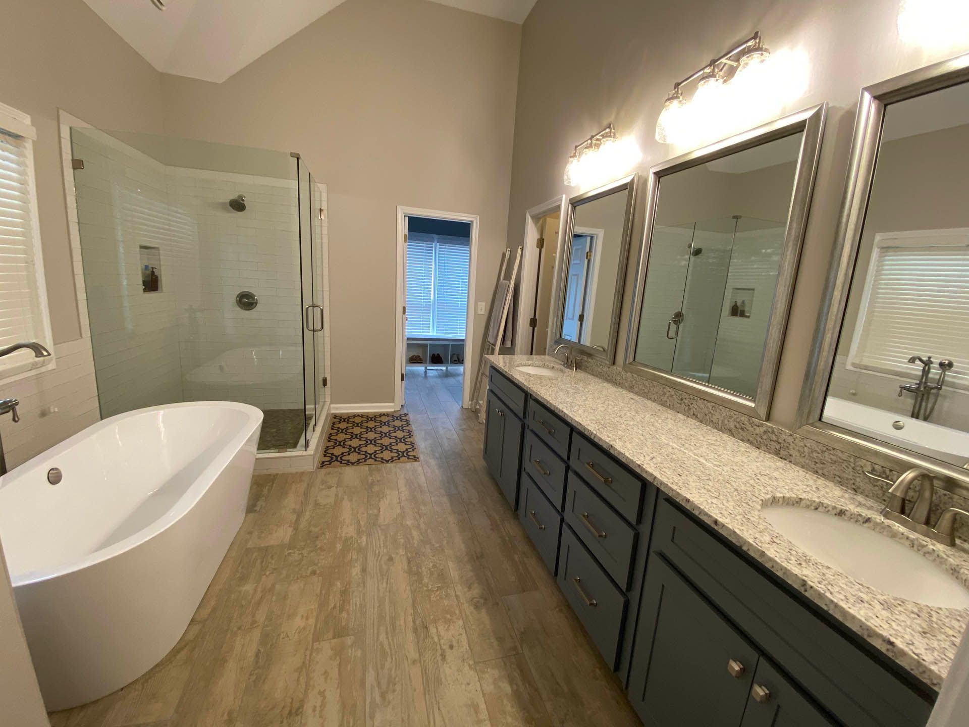 a bathroom with a bathtub and two sinks