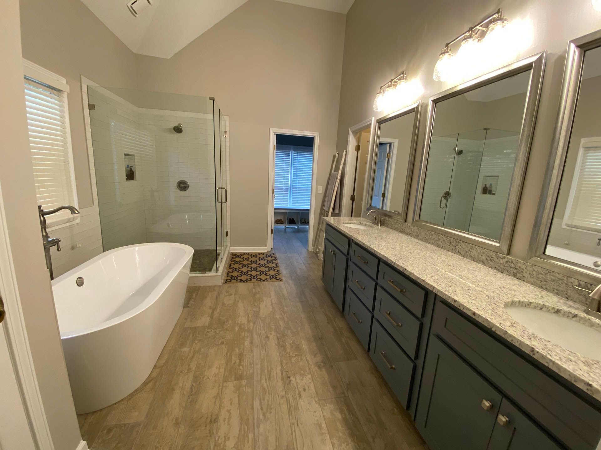 a bathroom with a bathtub and two sinks