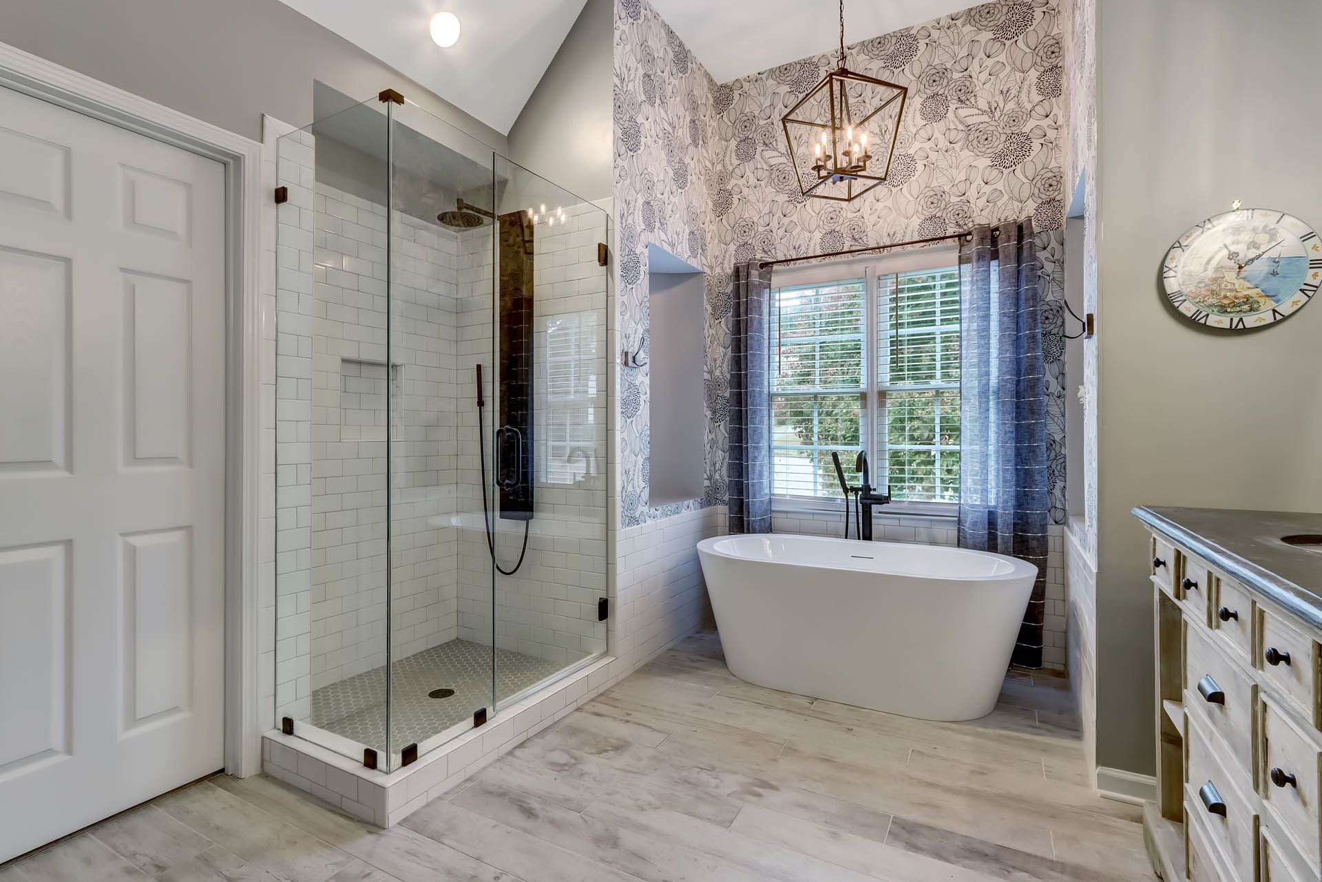 a bathroom with a bathtub and a shower