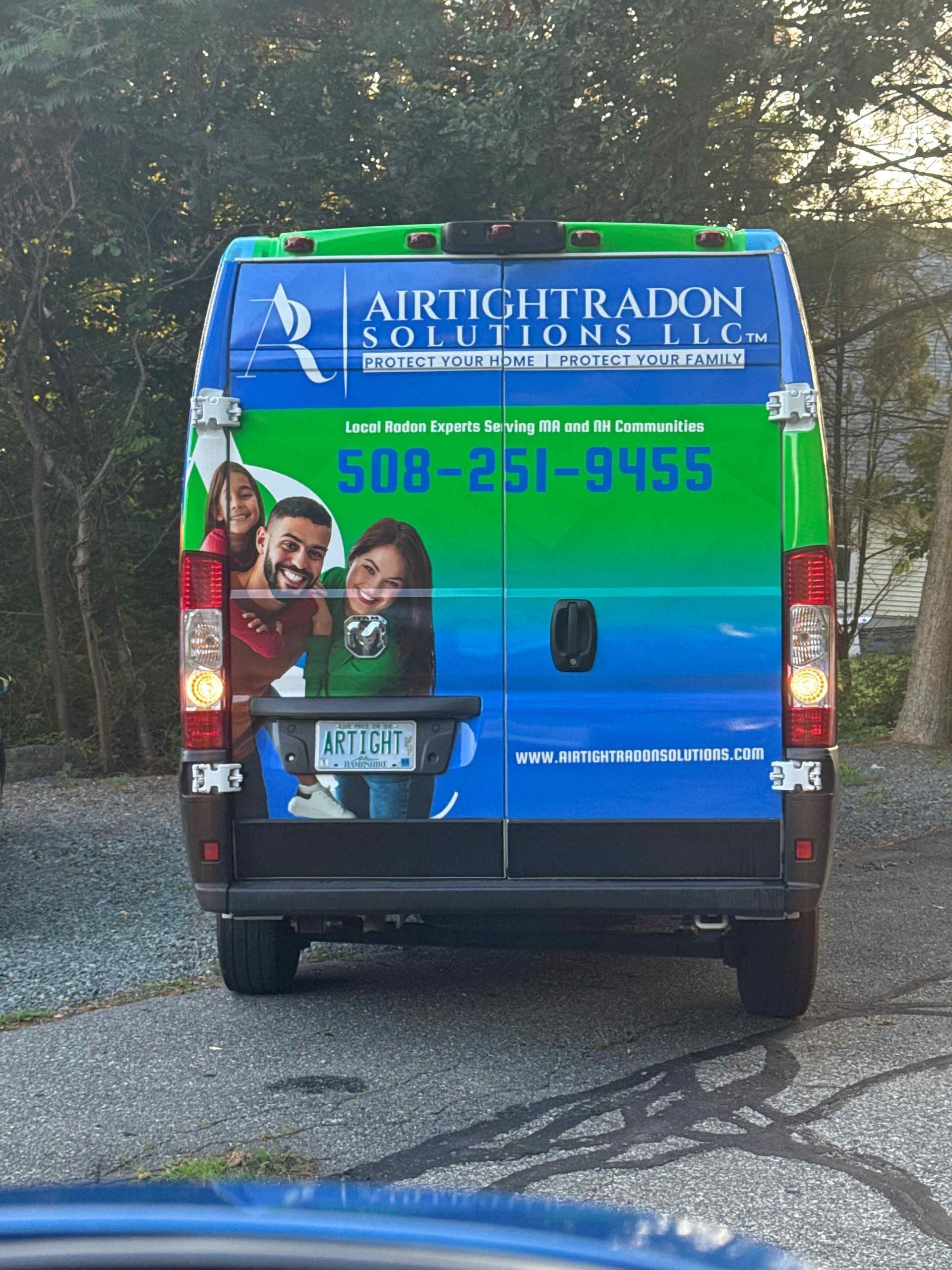 Back of a company van with a bright design, 
