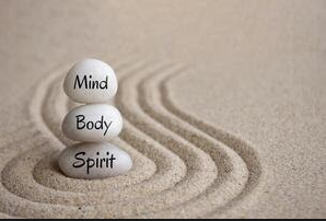Three stacked white stones with the words 