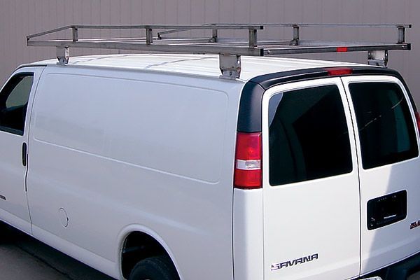 A white van with a roof rack on top of it