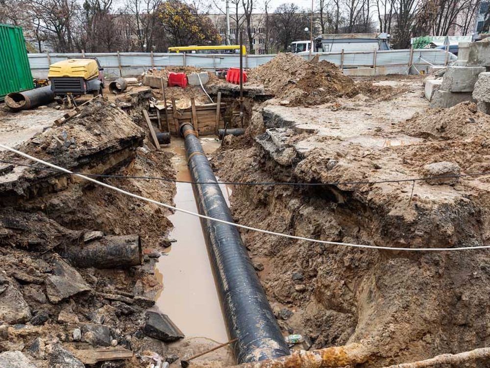 Aerial view of a winding river flowing through a dense, green forest.